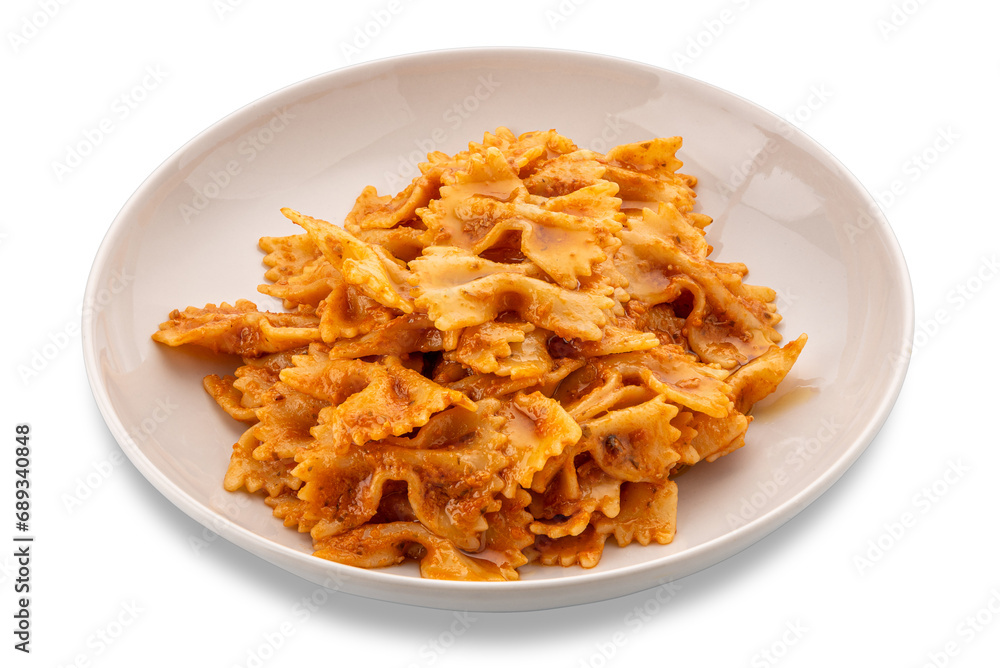 Farfalle pasta with tomato and chili and garlic sauce and olive oil in white plate isolated Farfalle pasta with tomato and chili and garlic sauce and olive oil in white plate isolated