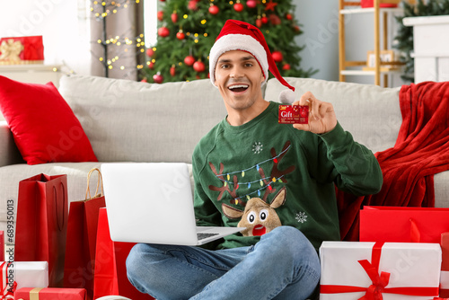 Young happy man with gift c...