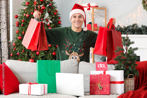 Young happy man with gift c...