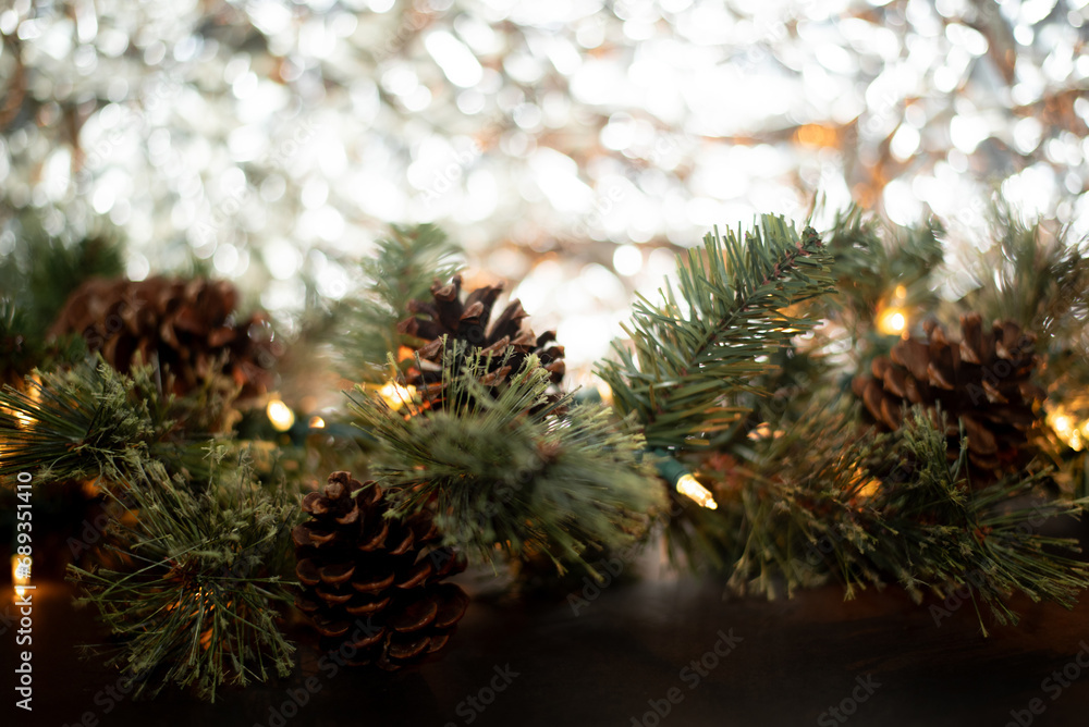 Close-up of a New Year's garland on a black background and a background of crumpled silver foil. Place for text. Postcard. Merry Christmas and Happy New Year Close-up of a New Year's garland on a black background and a background of crumpled silver foil. Place for text. Postcard. Merry Christmas and Happy New Year