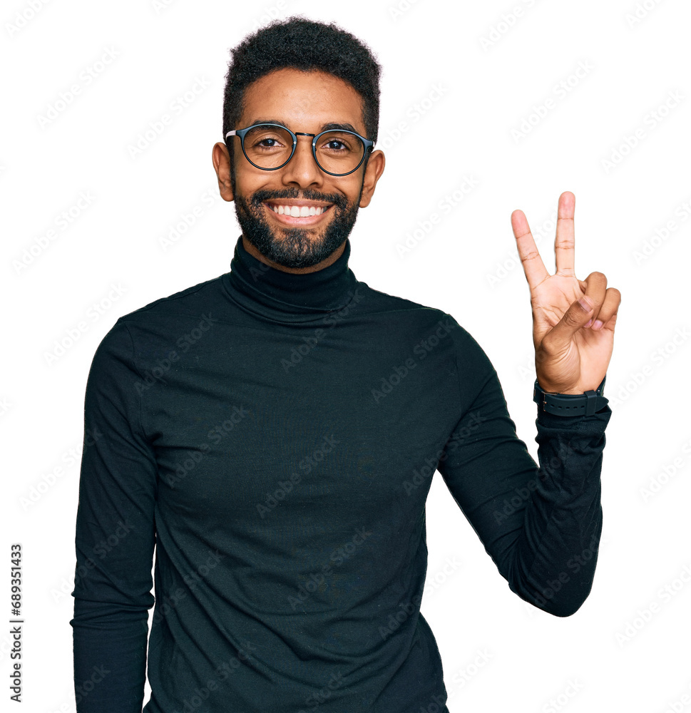 Young african american man wearing casual clothes smiling with happy face winking at the camera doing victory sign. number two. Young african american man wearing casual clothes smiling with happy face winking at the camera doing victory sign. number two.