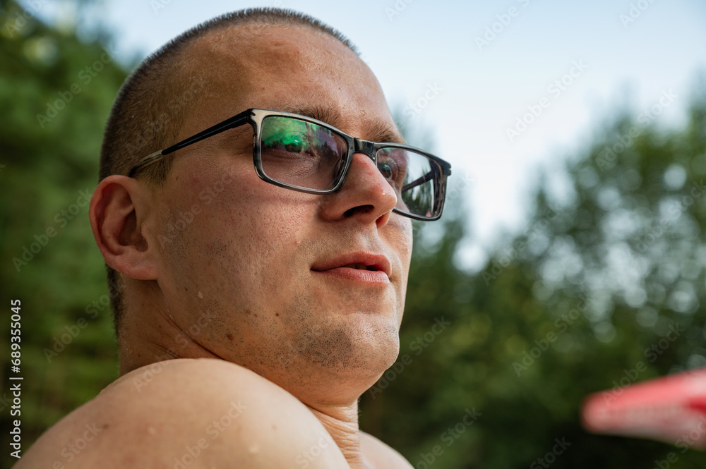 Man in glasses with myopia outdoor Man in glasses with myopia outdoor