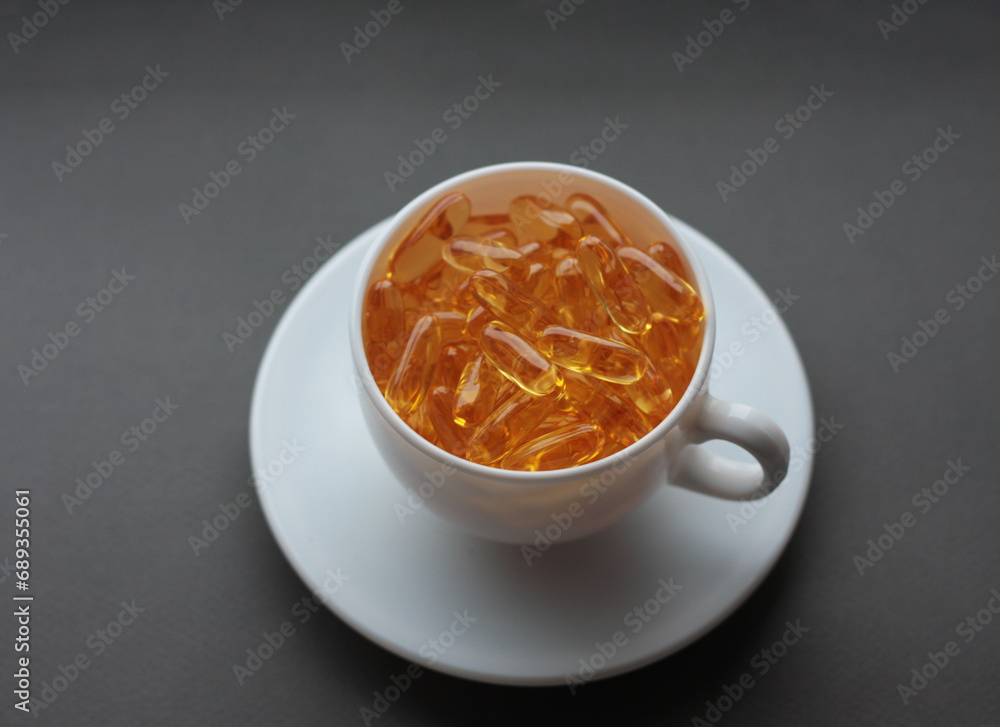 white cup and saucer filled with vitamins white cup and saucer filled with vitamins