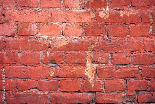 Empty brick red wall. background of a old brick house.