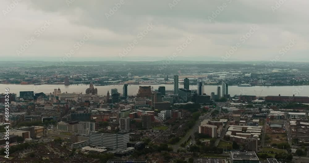 Urban panorama of modern architecture in Liverpool's cityscape with cloudy sky. Urban panorama of modern architecture in Liverpool's cityscape with cloudy sky.