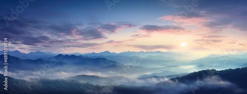 fog and a mountain top at sunset,