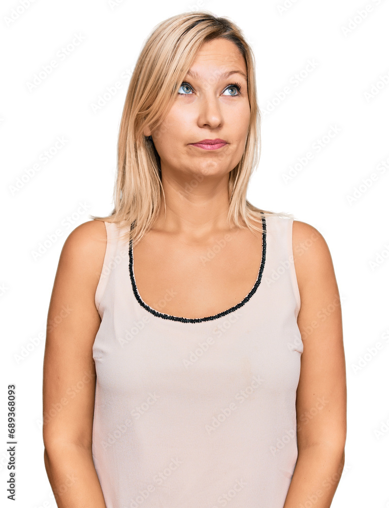 Middle age caucasian woman wearing casual clothes smiling looking to the side and staring away thinking. Middle age caucasian woman wearing casual clothes smiling looking to the side and staring away thinking.