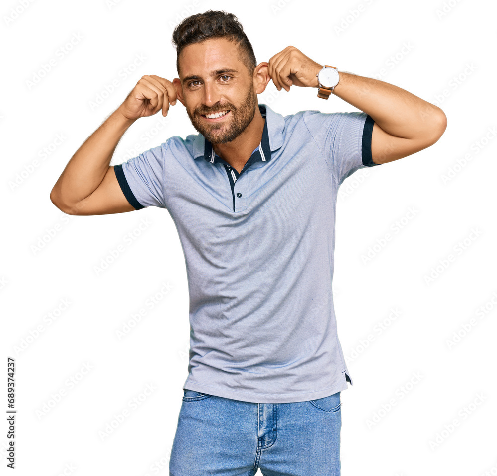 Handsome man with beard wearing casual clothes smiling pulling ears with fingers, funny gesture. audition problem Handsome man with beard wearing casual clothes smiling pulling ears with fingers, funny gesture. audition problem