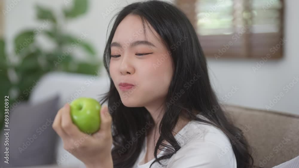 Young woman eating an apple for diet, healthy lifestyle . Young woman eating an apple for diet, healthy lifestyle .