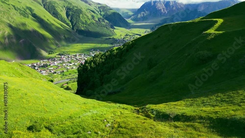 green valley of mountains - drone flight photo