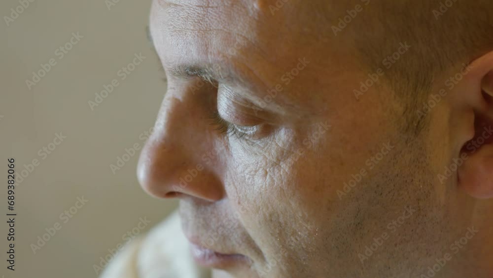 Close-up on the face of worried middle aged man. High quality 4k footage Close-up on the face of worried middle aged man. High quality 4k footage