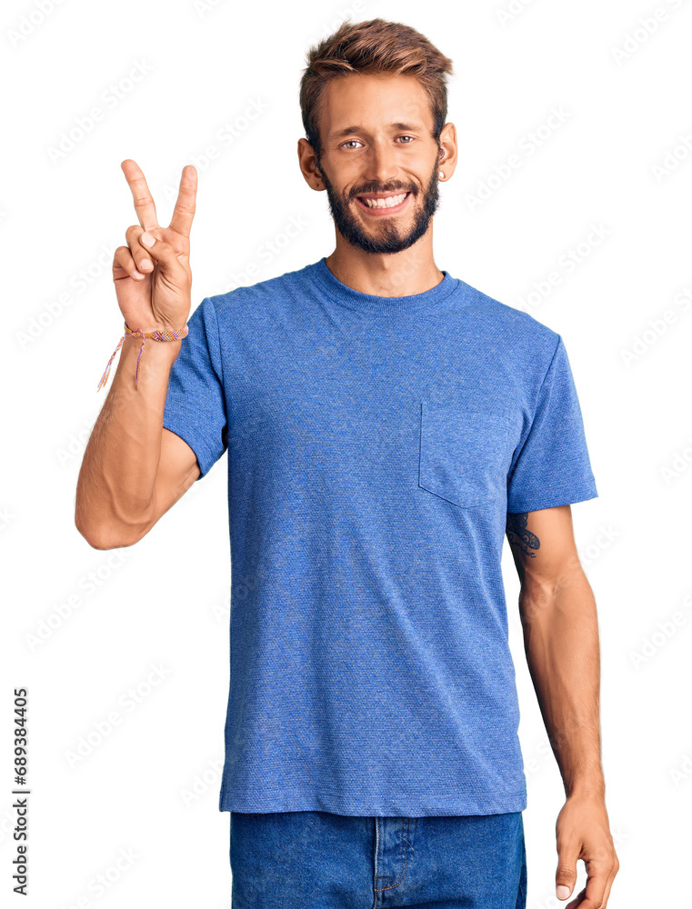 Handsome blond man with beard wearing casual clothes smiling with happy face winking at the camera doing victory sign. number two. Handsome blond man with beard wearing casual clothes smiling with happy face winking at the camera doing victory sign. number two.