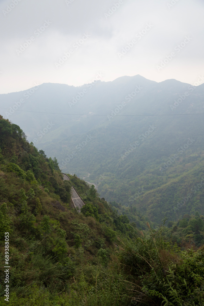 Majestic view of himalayan mountains, surrounded by dense green forests of senchal forest.shot in darjeeling the highest peak of west bengal. Majestic view of himalayan mountains, surrounded by dense green forests of senchal forest.shot in darjeeling the highest peak of west bengal.