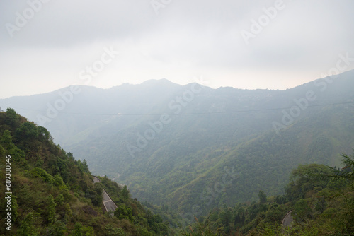 Majestic view of himalayan mountains  surrounded by dense green forests of senchal forest.shot in darjeeling the highest peak of west bengal.