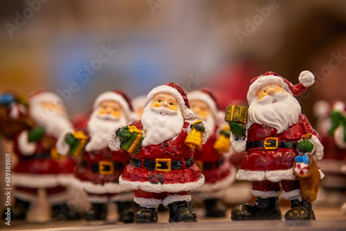 Many toy Santa Claus Christmas background. Happy New Year and Xmas theme.