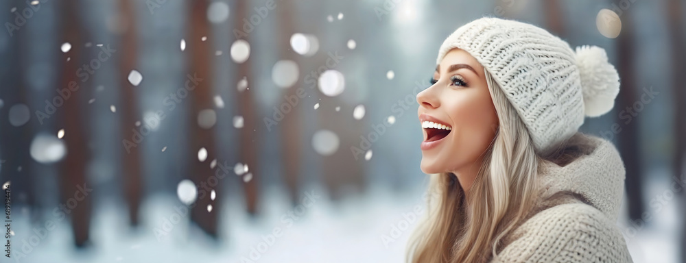 Joyful woman enjoying the winter snow in a forest, laughter as bright as the day. Panorama with copy space. White background. Joyful woman enjoying the winter snow in a forest, laughter as bright as the day. Panorama with copy space. White background.