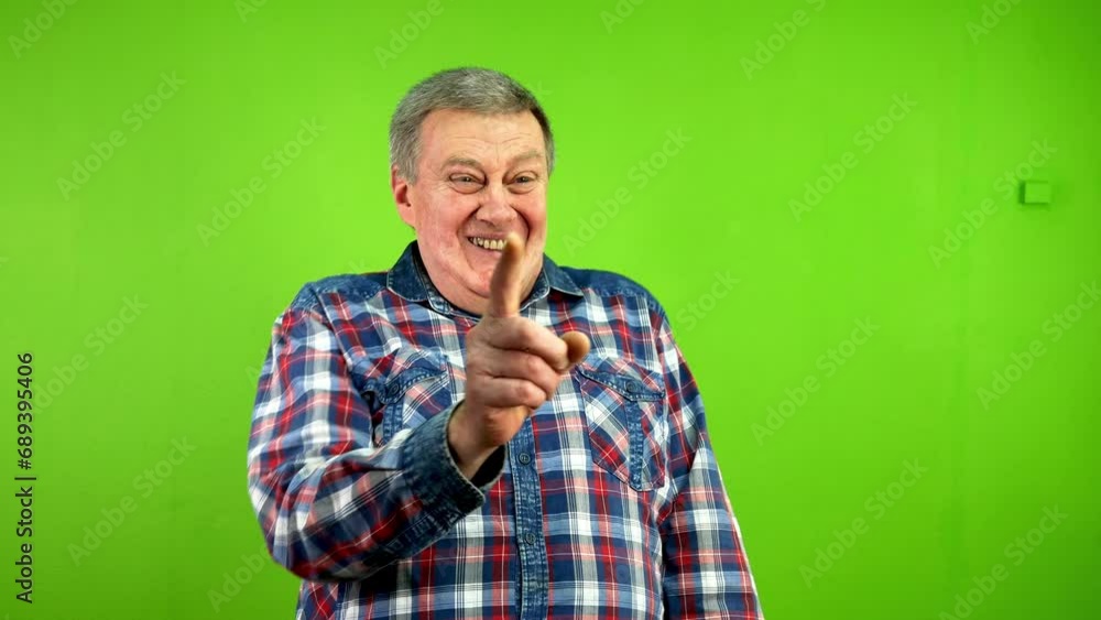 Senior man laughing and pointing index finger some one to camera hilarious. Senior man laughing and pointing index finger some one to camera hilarious.