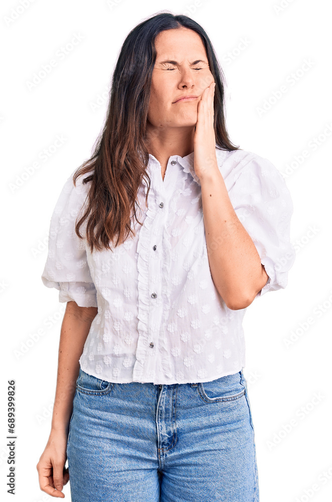 Young beautiful brunette woman wearing casual shirt touching mouth with hand with painful expression because of toothache or dental illness on teeth. dentist Young beautiful brunette woman wearing casual shirt touching mouth with hand with painful expression because of toothache or dental illness on teeth. dentist