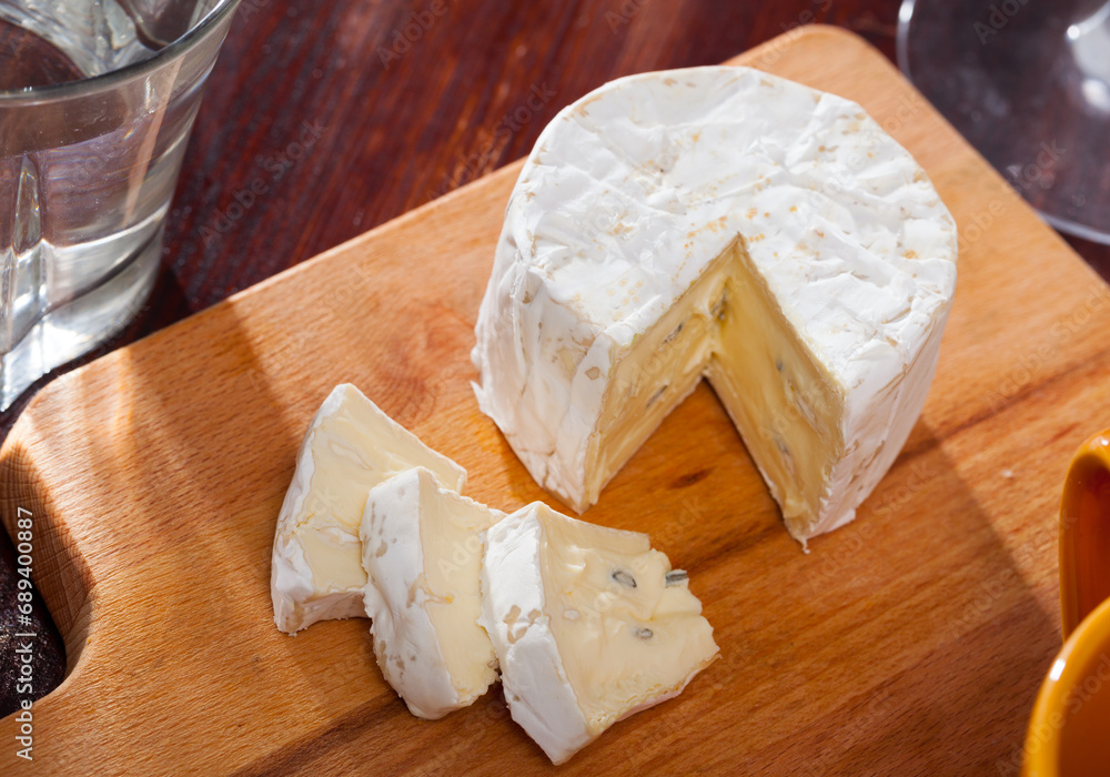 Picture of tasty french cambozola cheese at wooden desk