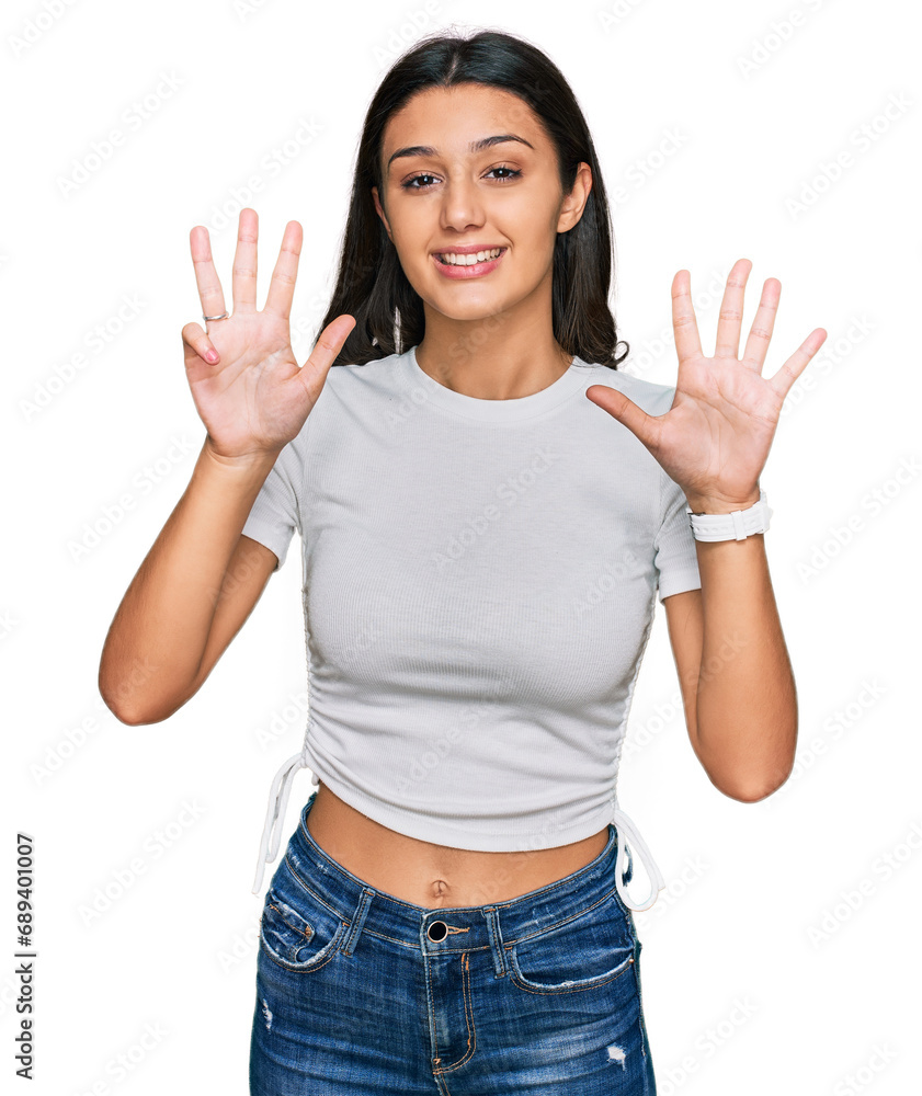 Young hispanic girl wearing casual white t shirt showing and pointing up with fingers number nine while smiling confident and happy. Young hispanic girl wearing casual white t shirt showing and pointing up with fingers number nine while smiling confident and happy.