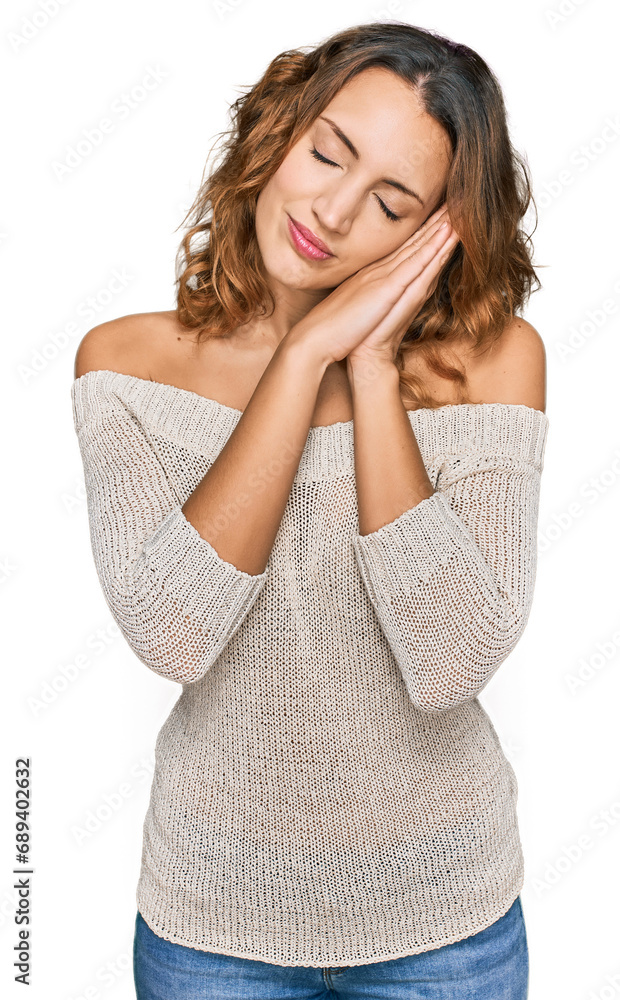 Beautiful young caucasian woman wearing casual clothes sleeping tired dreaming and posing with hands together while smiling with closed eyes.