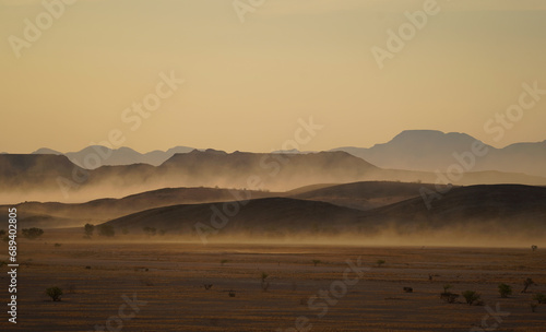 Sunset in the desert and mountains, sandstorm. Damaraland, Namibia 