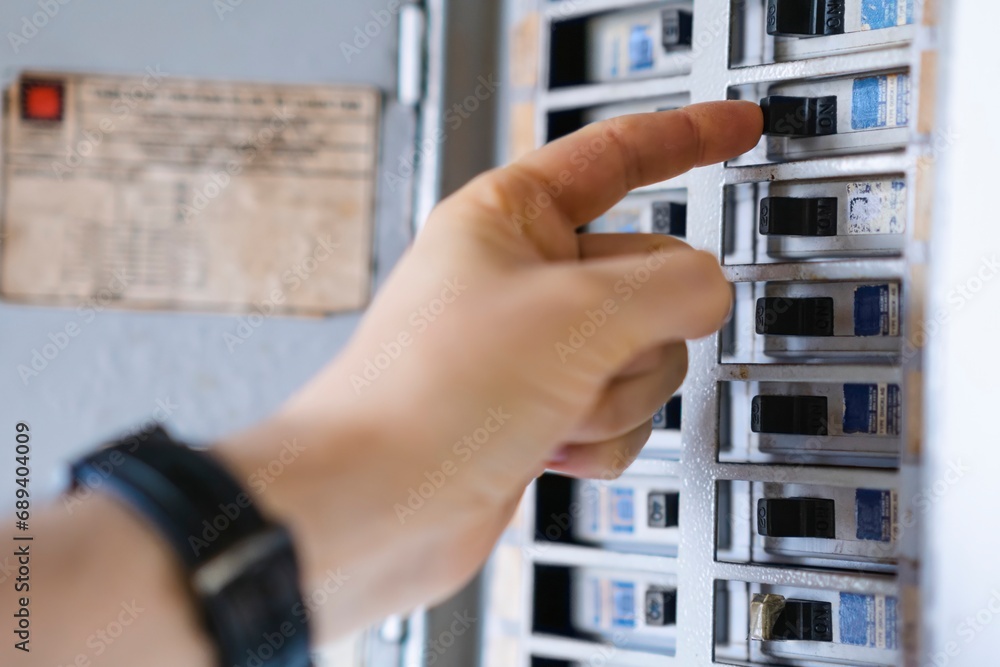 Ταπετσαρία Hand turns on electricity breaker, home light control, electrical system mainten