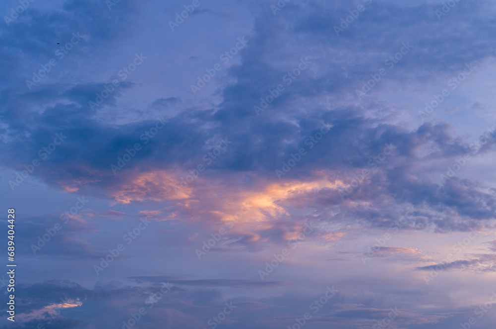 Marvel at the serene beauty of twilight cloudscape, with a vibrant interplay of colors against the evening sky. Marvel at the serene beauty of twilight cloudscape, with a vibrant interplay of colors against the evening sky.