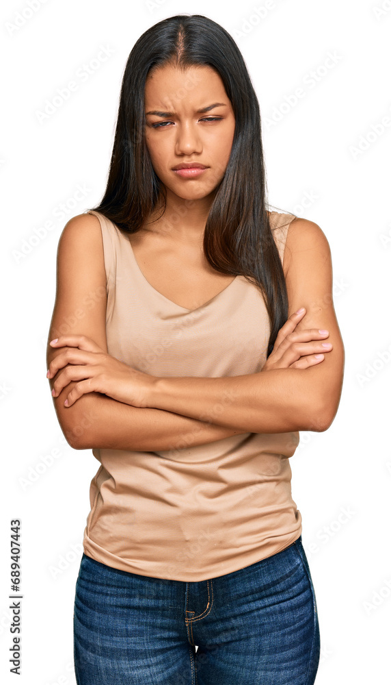 Obraz premium Beautiful hispanic woman wearing casual clothes skeptic and nervous, disapproving expression on face with crossed arms. negative person.