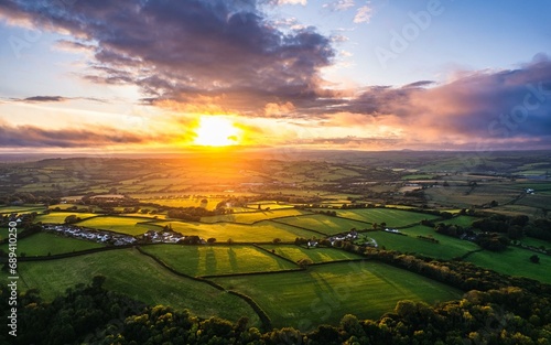 Sunset over Fields and Farms from a drone, Green Castle Wood, River Towy, Carmarthen, Wales, England, United Kingdom, Europe
