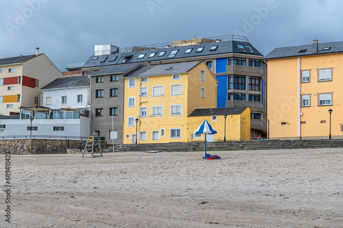 Buildings in front of Burela beach, Spain photo