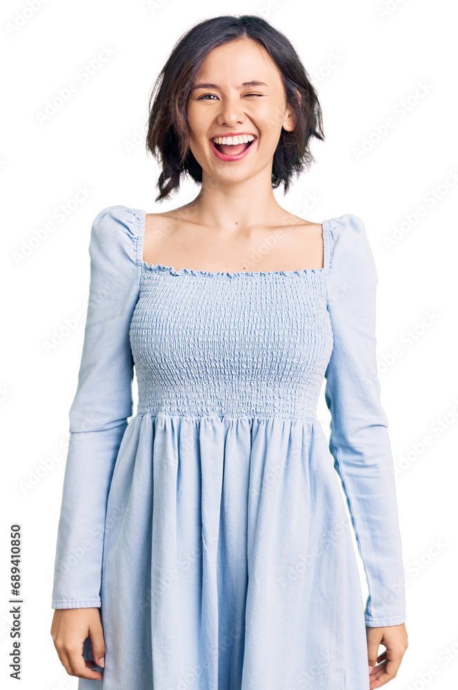 Young beautiful girl wearing casual clothes winking looking at the camera with sexy expression, cheerful and happy face. Young beautiful girl wearing casual clothes winking looking at the camera with sexy expression, cheerful and happy face.