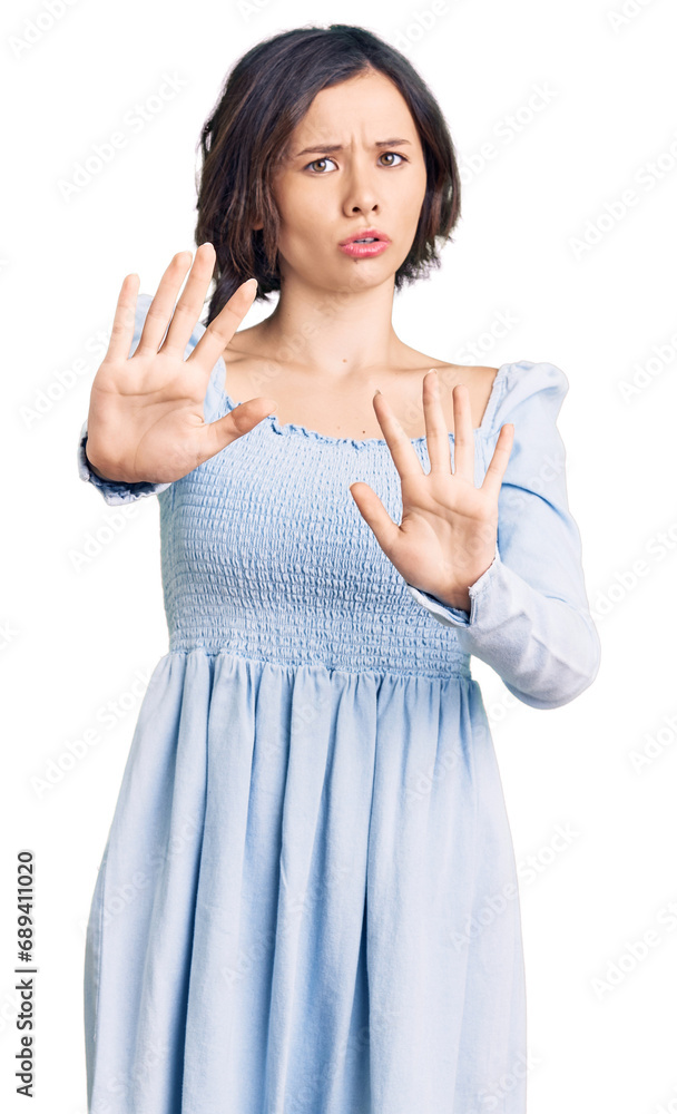 Young beautiful girl wearing casual clothes moving away hands palms showing refusal and denial with afraid and disgusting expression. stop and forbidden. Young beautiful girl wearing casual clothes moving away hands palms showing refusal and denial with afraid and disgusting expression. stop and forbidden.
