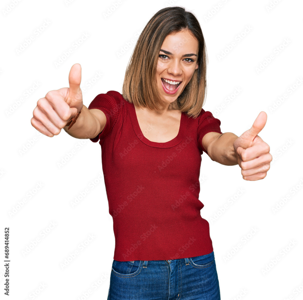 Young blonde girl wearing casual clothes approving doing positive gesture with hand, thumbs up smiling and happy for success. winner gesture. Young blonde girl wearing casual clothes approving doing positive gesture with hand, thumbs up smiling and happy for success. winner gesture.