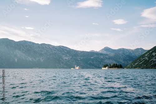 Island of St. George in the Bay of Kotor with the island of Gospa od Skrpjela in the background. Montenegro © Nadtochiy