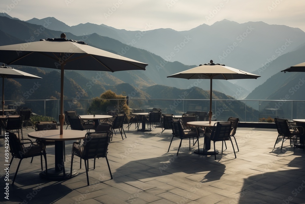 Outdoor café terrace with scenic mountain views, a serene spot for relaxation and contemplation.

