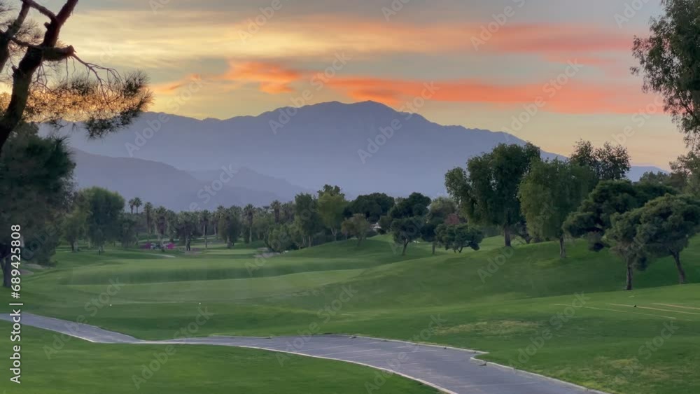 Beautiful Palm Desert sunset with sun setting over the mountains, Southern California Beautiful Palm Desert sunset with sun setting over the mountains, Southern California