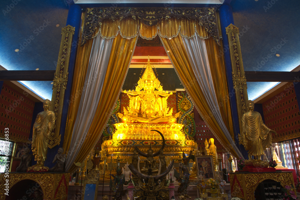 Phra Buddha Hiranrat His body was dressed in royal garb in the pose of bestowing blessings as the principal Buddha image. At Sacred Hall in Wat Tha Mai temple. Located at Samut Sakhon in Thaiiand.