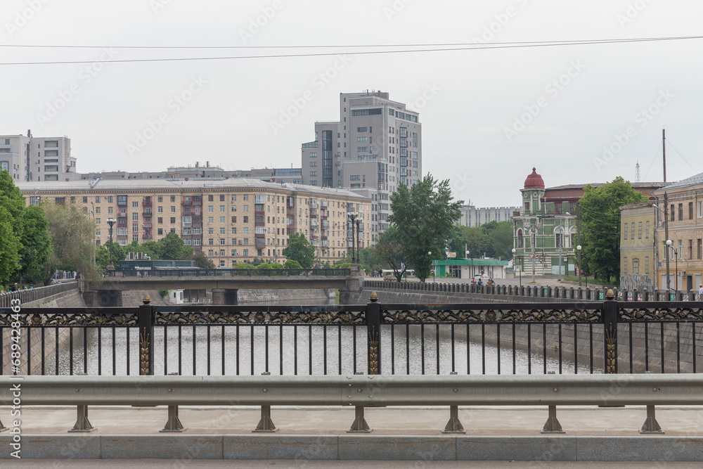 scenery of historical cityscape and river seen from the bridge in kharkiv city