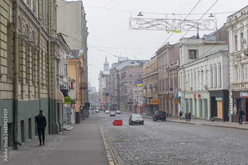 cars and pedestrians passing on the historical street in kharkiv city