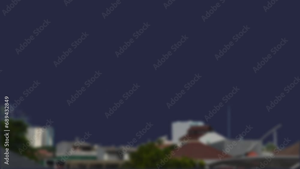 two lightning strikes in the blue sky with blurred urban buildings in the foreground. two lightning strikes in the blue sky with blurred urban buildings in the foreground.
