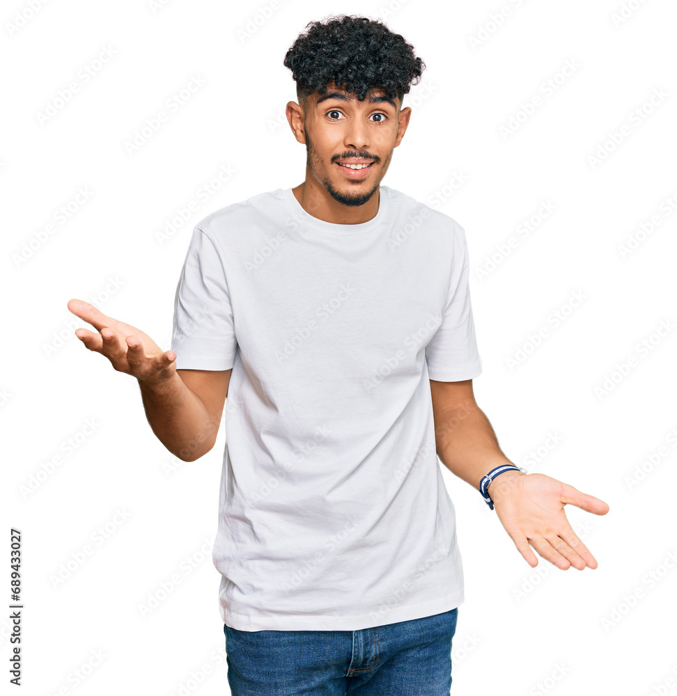 Young arab man wearing casual white t shirt smiling cheerful with open arms as friendly welcome, positive and confident greetings Young arab man wearing casual white t shirt smiling cheerful with open arms as friendly welcome, positive and confident greetings