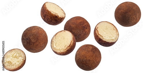Falling marzipan potatoes isolated on white background photo