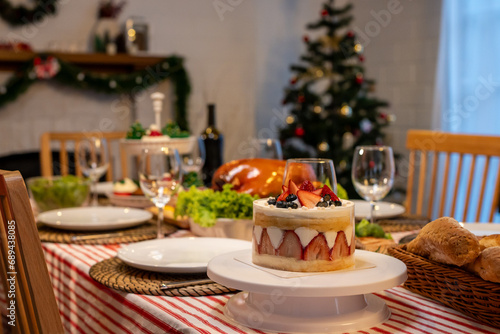 Shot of Christmas turkey and many of foods on table in decorating room. 