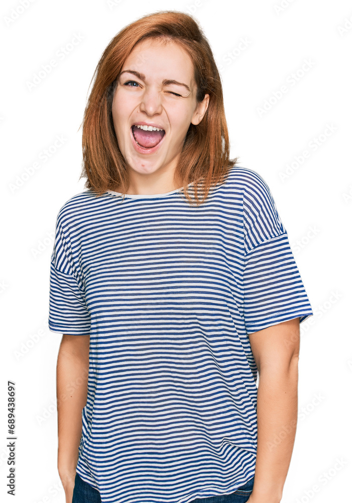Young caucasian woman wearing casual clothes winking looking at the camera with sexy expression, cheerful and happy face. Young caucasian woman wearing casual clothes winking looking at the camera with sexy expression, cheerful and happy face.