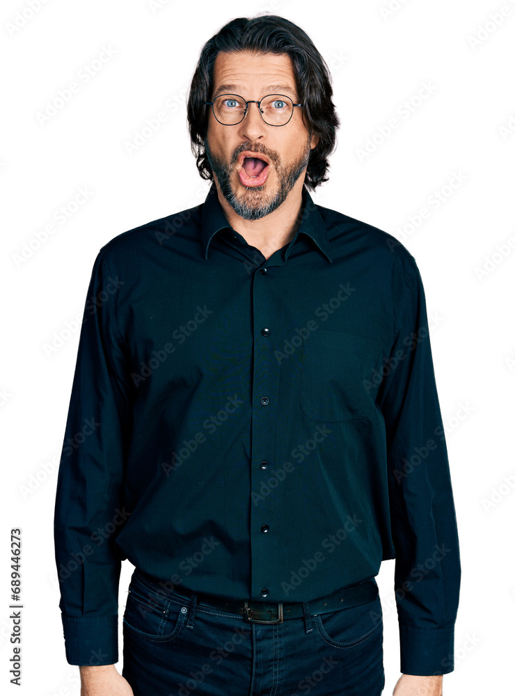 Middle age caucasian man wearing casual clothes and glasses afraid and shocked with surprise expression, fear and excited face.