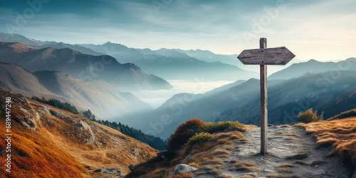 Photo road signpost, guiding travelers against the backdrop of a misty, mountainous la