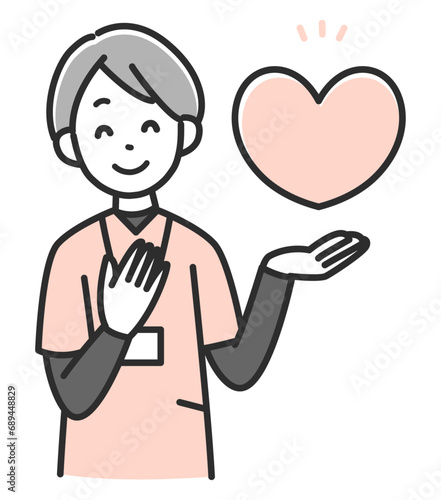 ハートマークを掲げる笑顔の女性医療スタッフ