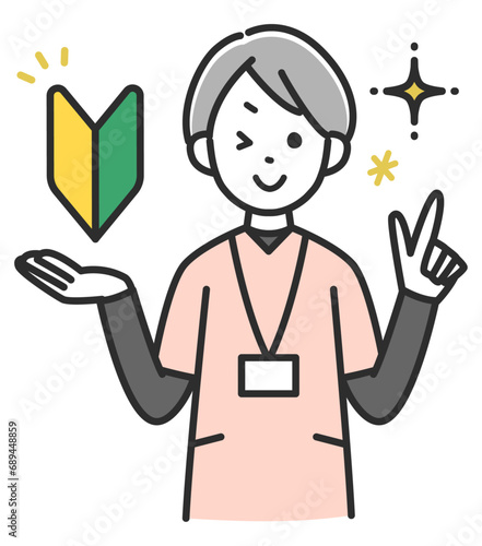 若葉マークを持った女性医療スタッフ