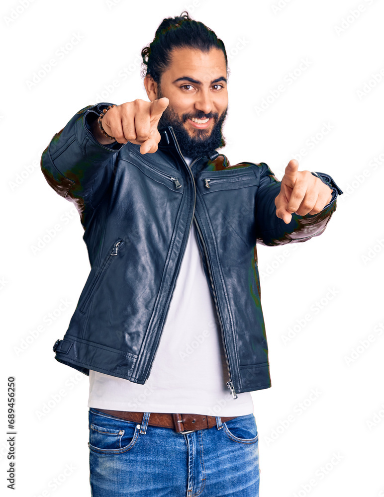 Fototapeta premium Young arab man wearing casual leather jacket pointing to you and the camera with fingers, smiling positive and cheerful